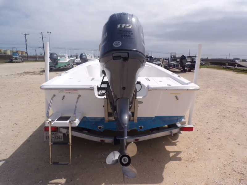 Slide: The Image of Rear view of a 2016 Sportsman 207 Masters boat with outboard motor. - 18