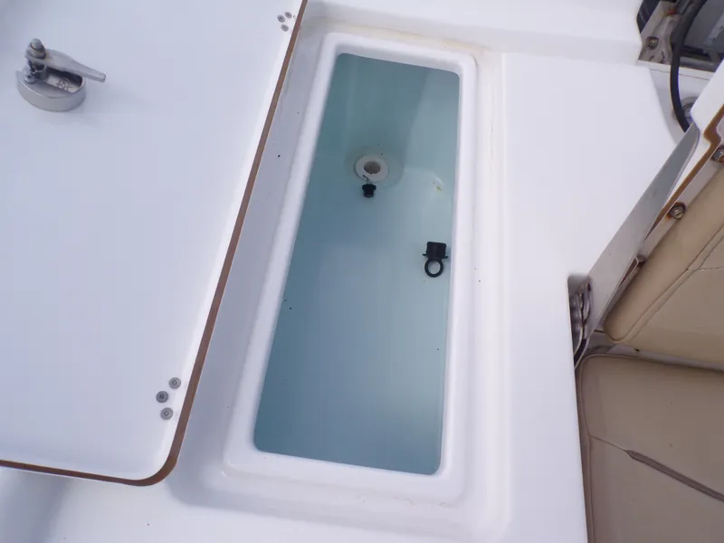 Slide: The Image of Open storage compartment on a 2016 Sportsman 207 Masters boat. - 27