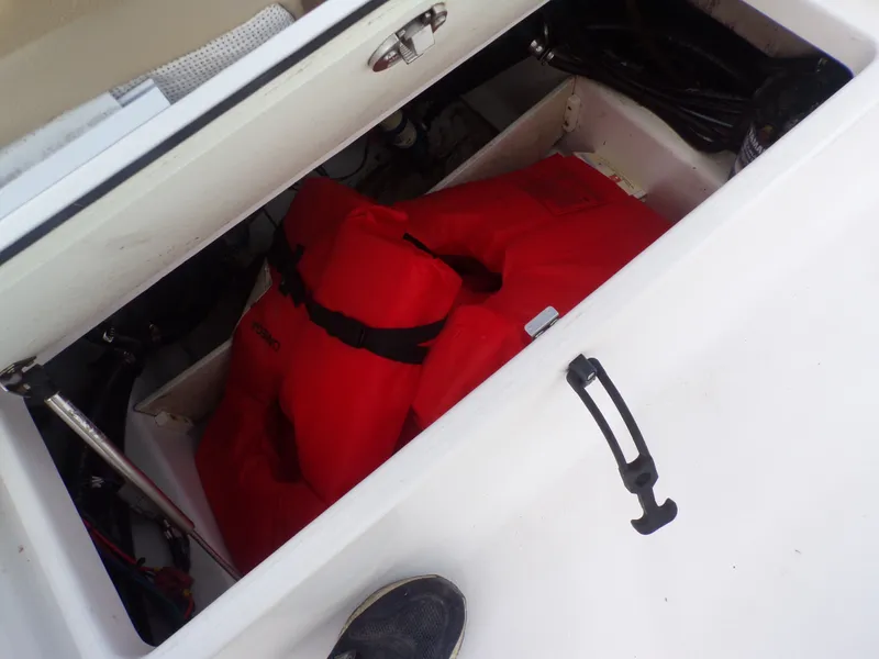 Slide: The Image of Red life jackets stored in a Sportsman 207 Masters boat. - 28