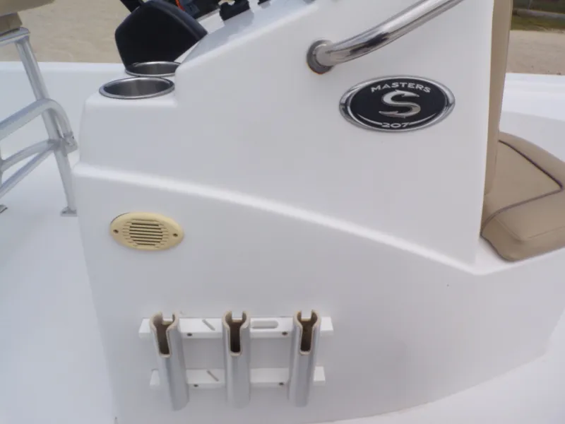 Slide: The Image of Sportsman 207 Masters boat console with cup holders and rod holders. - 33