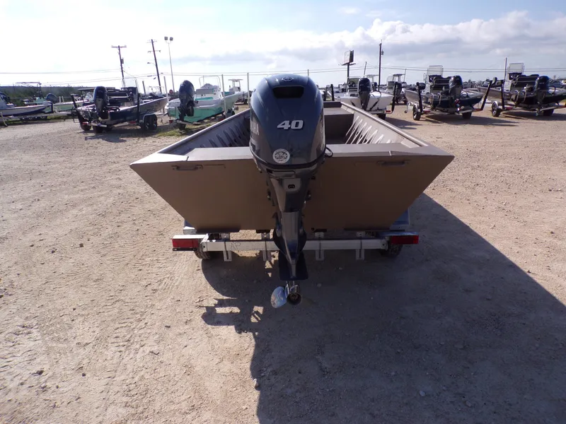 Slide: The Image of Weldcraft 1652 CDL FO 2026 boat with outboard motor on trailer. - 5