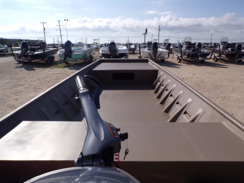 Slide: The Image of Weldcraft 1652 CDL FO 2026 boat on a lot with trailers. - 8