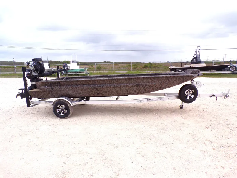Slide: The Image of 2026 Xpress Bayou 180 boat on trailer outdoors. - 12