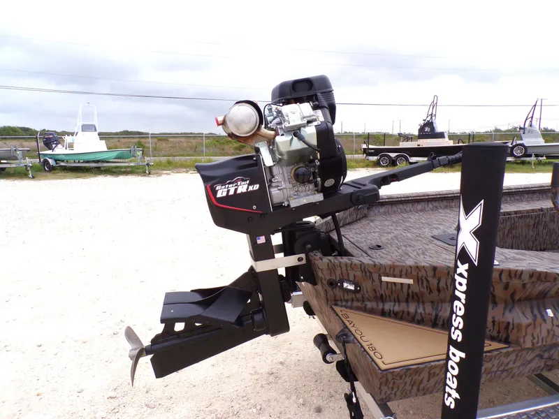 Slide: The Image of Xpress Bayou 180 boat with Gator-Tail motor, 2026 model. - 13