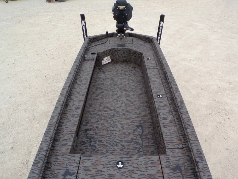 Slide: The Image of 2026 Xpress Bayou 180 boat with camouflage pattern on sand. - 16