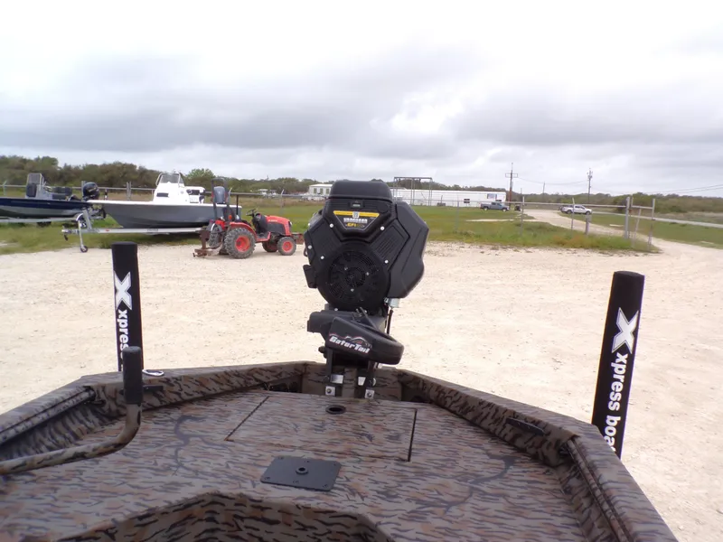 Slide: The Image of 2026 Xpress Bayou 180 boat with GatorTail motor on parking lot. - 22