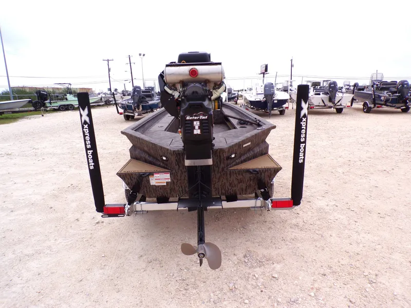 Slide: The Image of Rear view of 2026 Xpress Bayou 180 boat model on a trailer. - 5