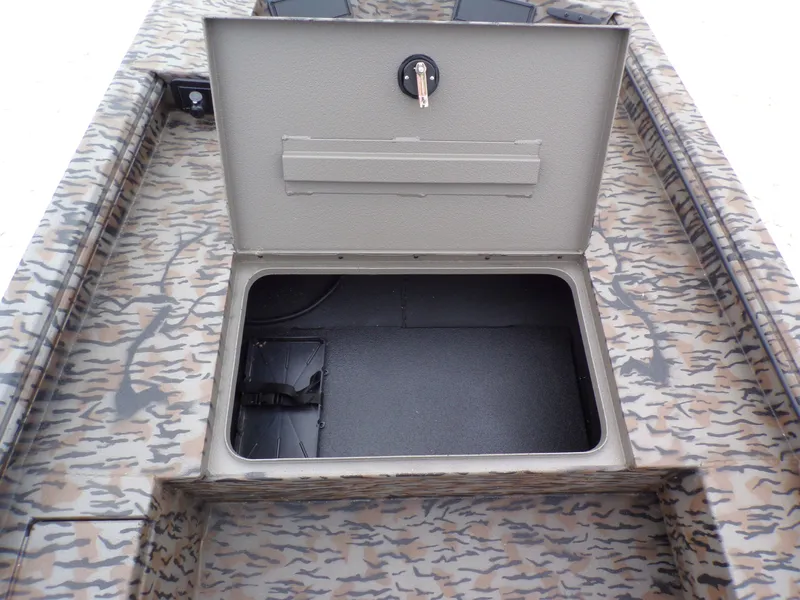 Slide: The Image of 2026 Xpress Bayou 180 boat with open storage compartment. - 6