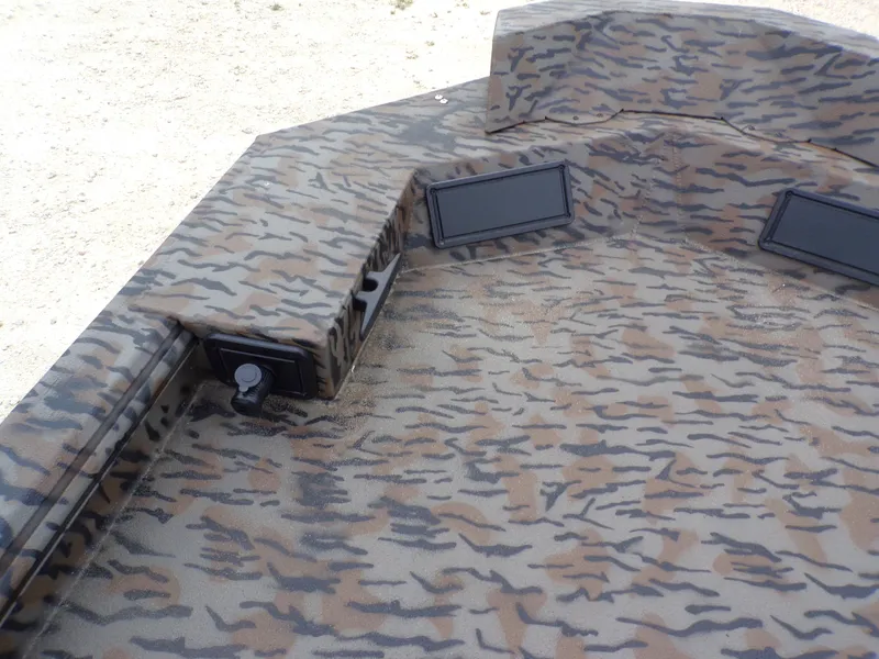 Slide: The Image of 2026 Xpress Bayou 180 boat with camouflage pattern design. - 7
