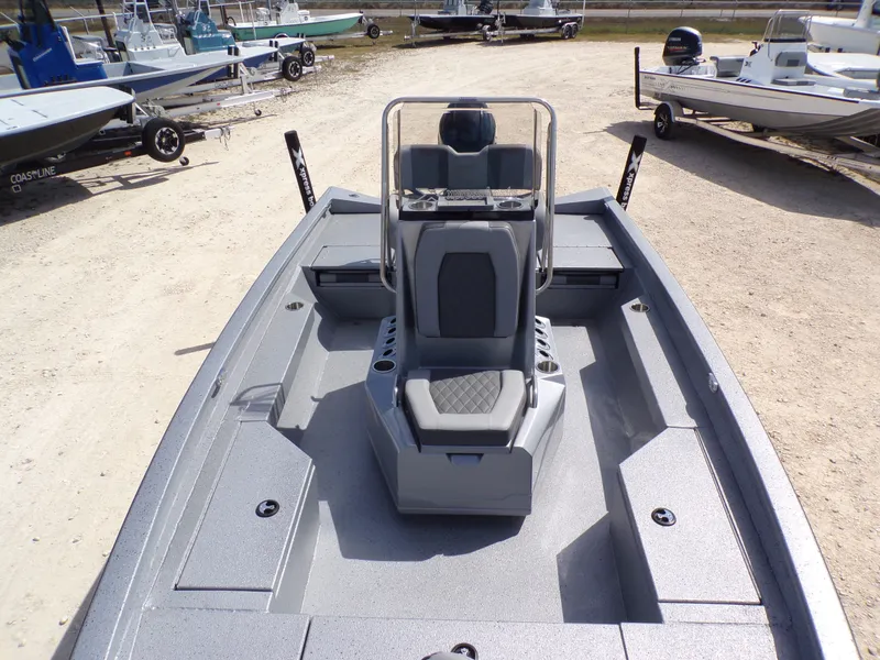 Slide: The Image of 2025 Xpress H20B Bay boat on a parking lot. - 12