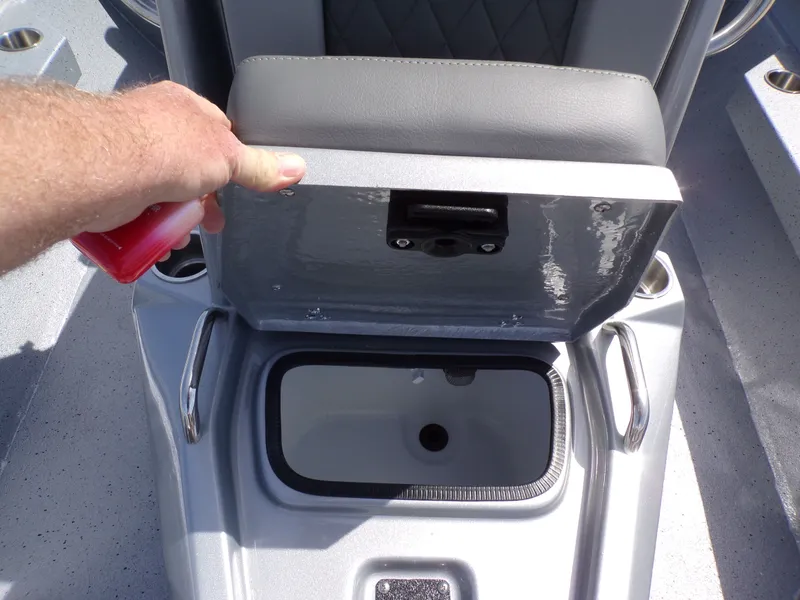 Slide: The Image of 2025 Xpress H20B Bay boat with open storage compartment. - 14
