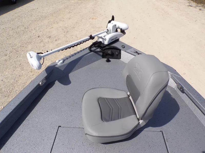 Slide: The Image of 2025 Xpress H20B Bay boat with gray seat and Minn Kota motor. - 15