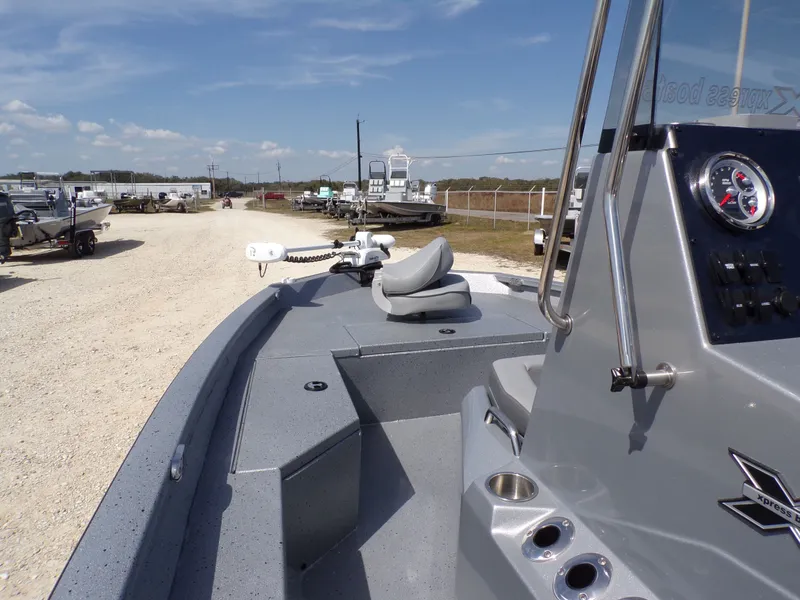Slide: The Image of 2025 Xpress H20B Bay boat on a sunny lot. - 16