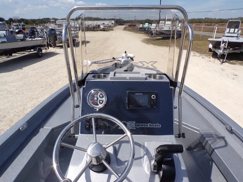 Slide: The Image of 2025 Xpress H20B Bay boat cockpit with controls and instruments. - 19