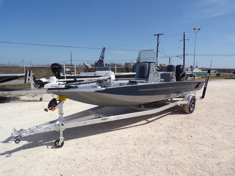 Slide: The Image of 2025 Xpress H20B Bay boat on trailer, sunny day. - 3