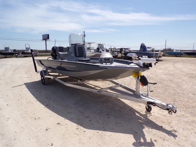 Slide: The Image of 2025 Xpress H20B Bay boat on trailer outdoors. - 7