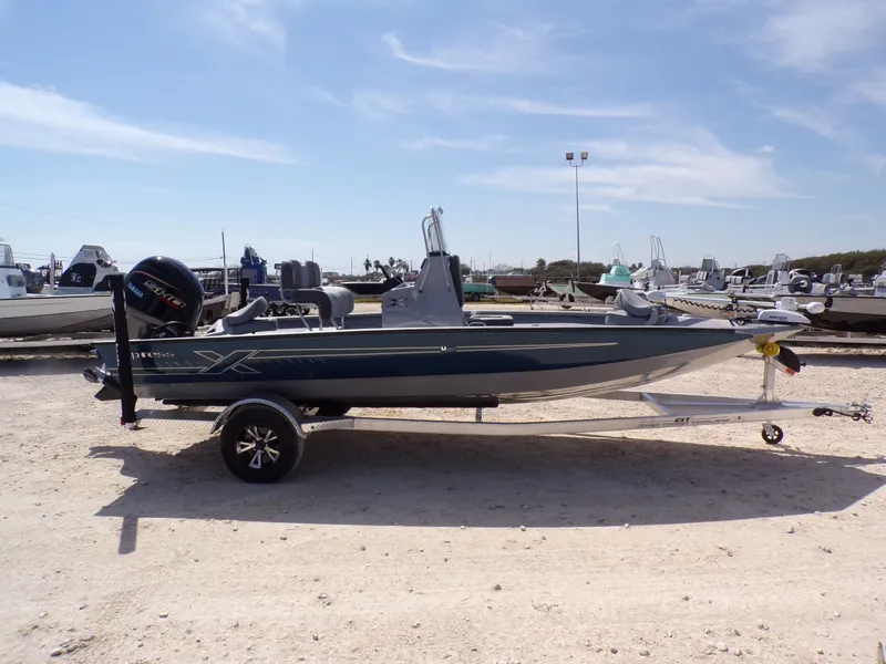 Slide: The Image of 2025 Xpress H20B Bay boat on trailer outdoors. - 8