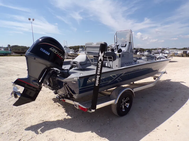 Slide: The Image of 2025 Xpress H20B Bay boat with Yamaha engine on trailer. - 9