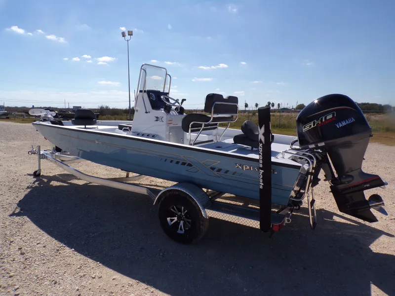 Slide: The Image of 2026 Xpress H20B Bay boat with Yamaha engine on trailer. - 10