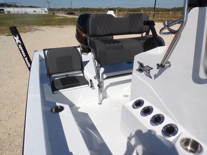 Slide: The Image of Interior of 2026 Xpress H20B Bay boat with seating and console. - 20