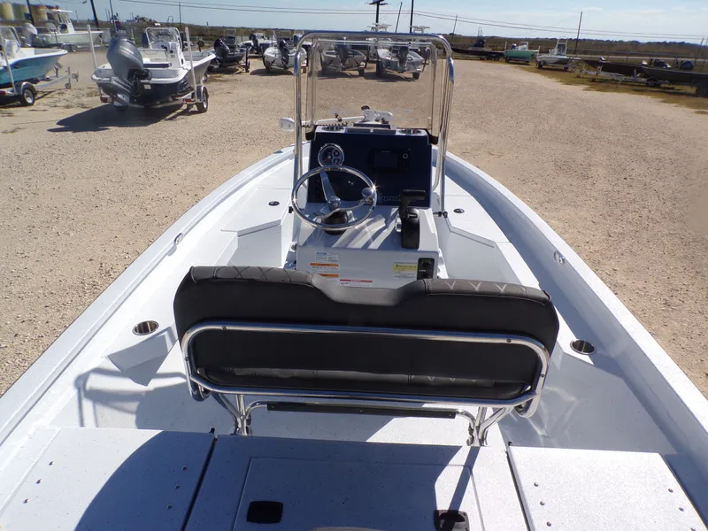 Slide: The Image of 2026 Xpress H20B Bay boat on a parking lot. - 23
