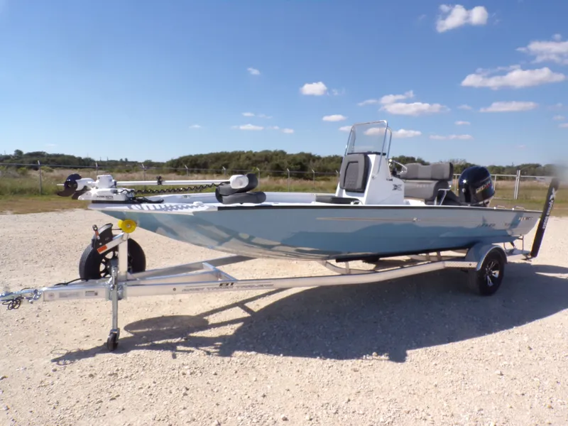 Slide: The Image of 2026 Xpress H20B Bay boat on trailer, blue sky. - 3