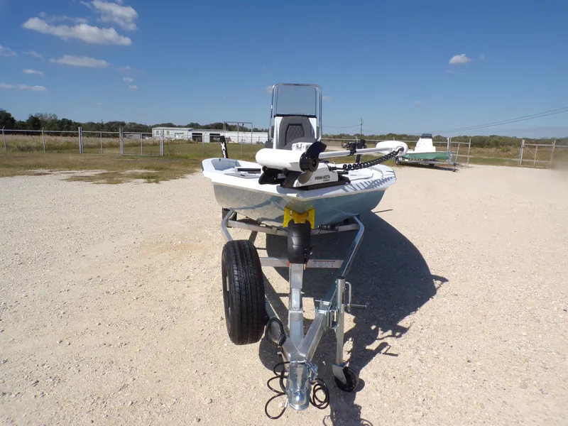 Slide: The Image of 2026 Xpress H20B Bay boat on trailer, sunny day. - 5