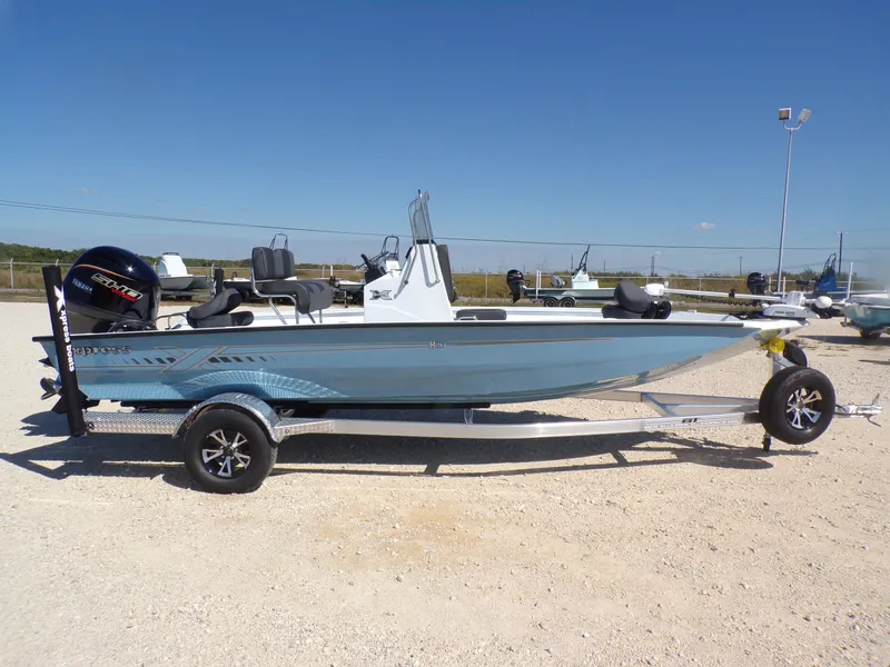 Slide: The Image of 2026 Xpress H20B Bay boat on trailer outdoors. - 7