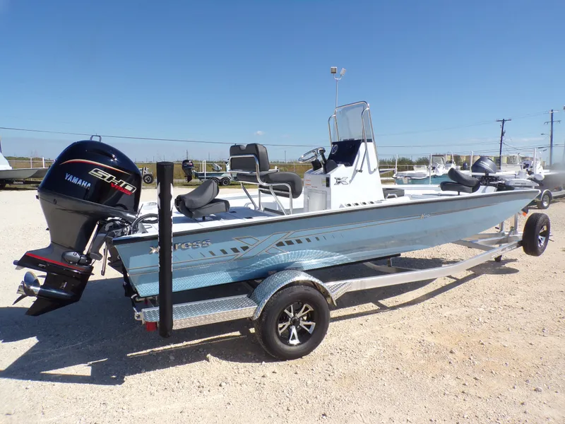 Slide: The Image of 2026 Xpress H20B Bay boat with Yamaha engine on trailer. - 8