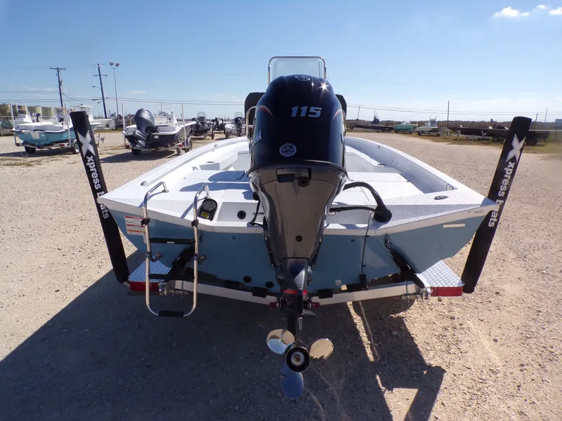 Slide: The Image of 2026 Xpress H20B Bay boat with Yamaha 115 engine, rear view. - 9