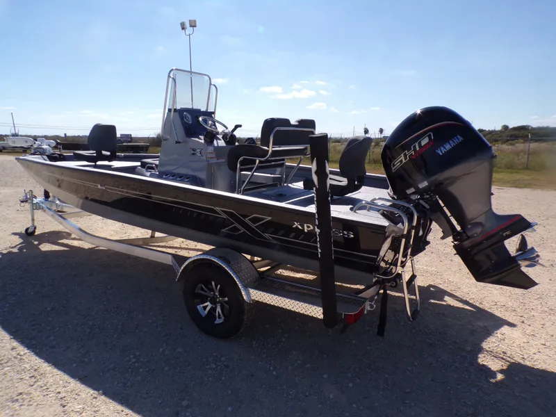 Slide: The Image of 2026 Xpress H20B Bay boat with Yamaha engine on trailer. - 10