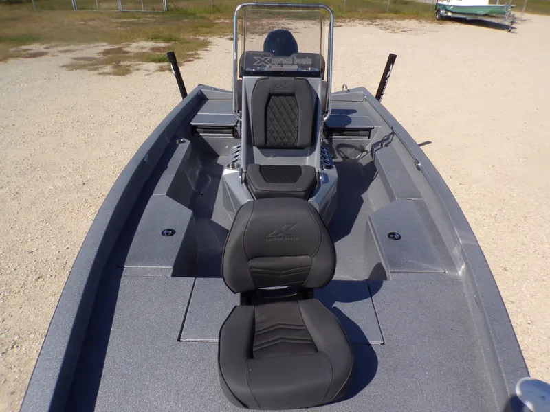 Slide: The Image of 2026 Xpress H20B Bay boat with gray seats and console. - 12