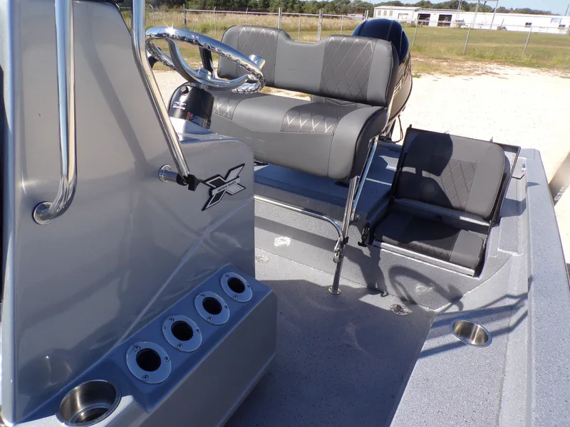Slide: The Image of Interior of 2026 Xpress H20B Bay boat with gray seating. - 18