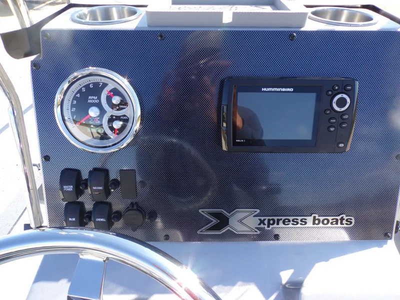 Slide: The Image of Dashboard of a 2026 Xpress H20B Bay boat. - 22