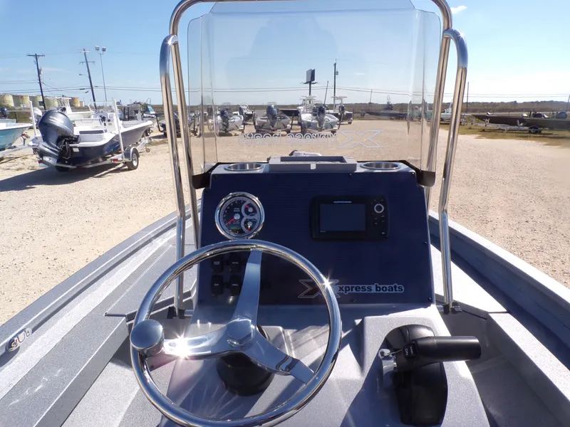 Slide: The Image of 2026 Xpress H20B Bay boat cockpit with steering and instruments. - 23