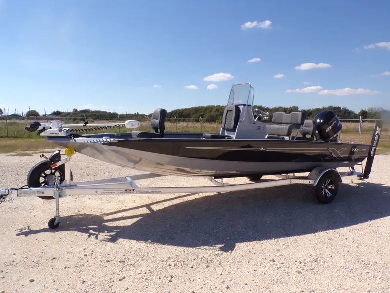 Slide: The Image of 2026 Xpress H20B Bay boat on trailer outdoors. - 3