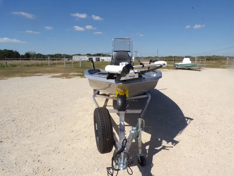 Slide: The Image of 2026 Xpress H20B Bay boat on trailer, sunny day. - 5