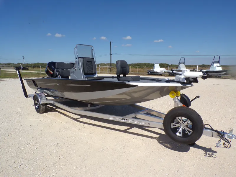 Slide: The Image of 2026 Xpress H20B Bay boat on trailer, side view. - 6