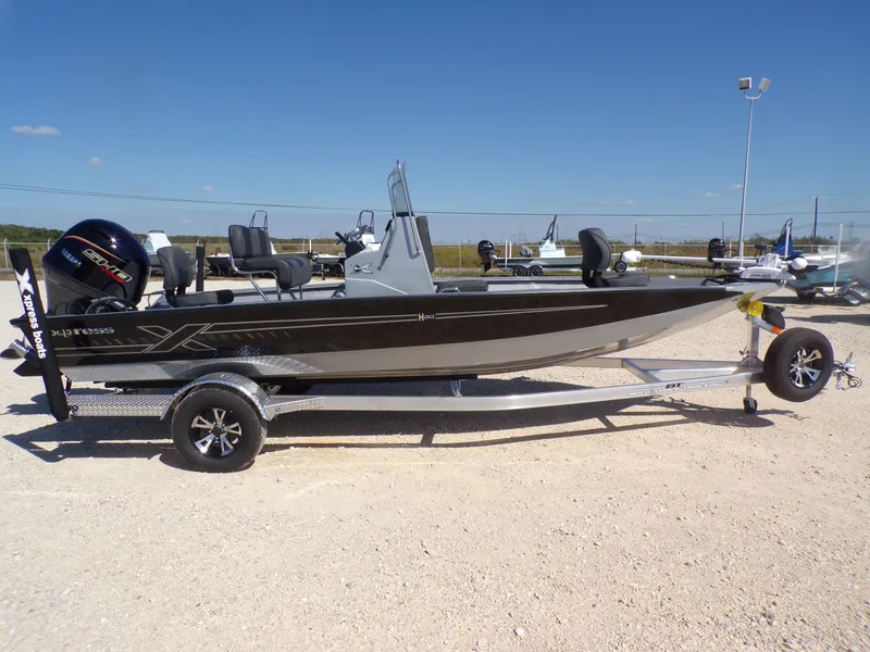 Slide: The Image of 2026 Xpress H20B Bay boat on trailer, side view. - 7