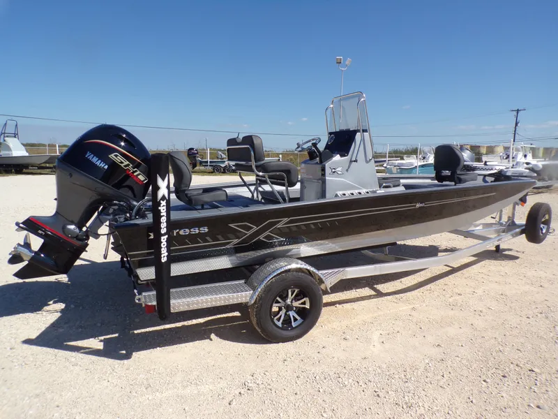 Slide: The Image of 2026 Xpress H20B Bay boat with Yamaha engine on trailer. - 8