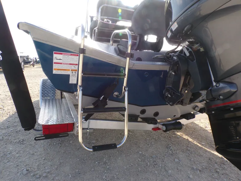 Slide: The Image of 2026 Xpress H20B Bay boat with ladder and motor view. - 10