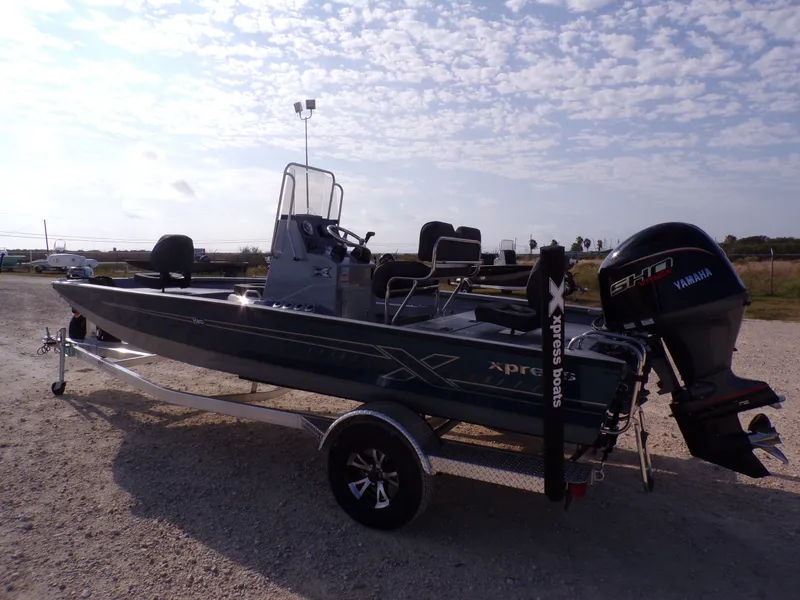 Slide: The Image of 2026 Xpress H20B Bay boat with Yamaha engine on trailer. - 11