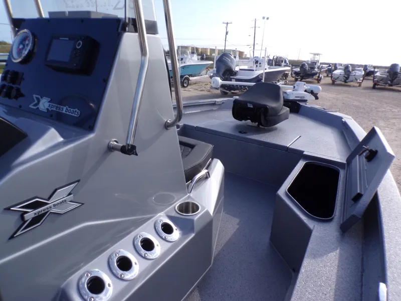 Slide: The Image of 2026 Xpress H20B Bay boat with console and storage compartments. - 16