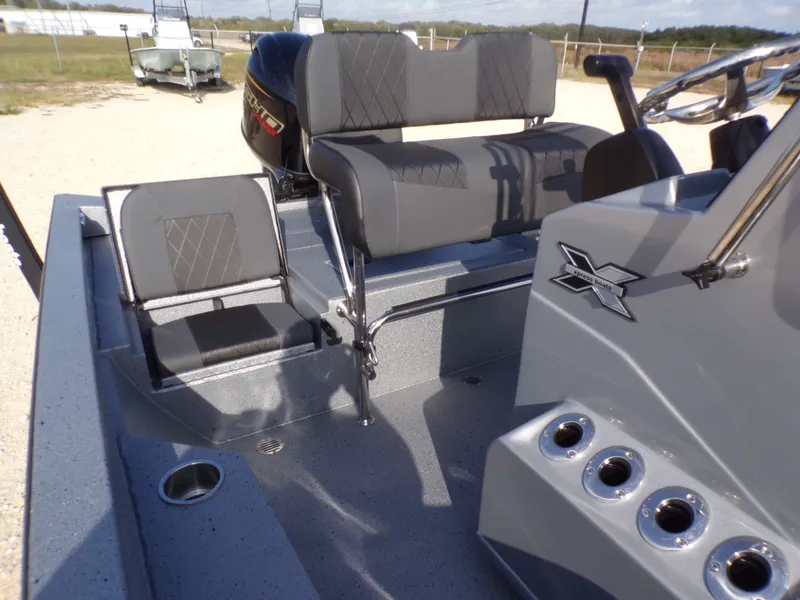 Slide: The Image of Interior of 2026 Xpress H20B Bay boat with gray seating. - 18