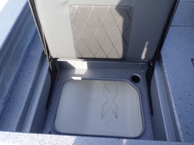 Slide: The Image of Xpress H20B Bay 2026 seat with open storage compartment. - 21