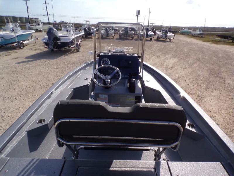 Slide: The Image of 2026 Xpress H20B Bay boat on a parking lot. - 23