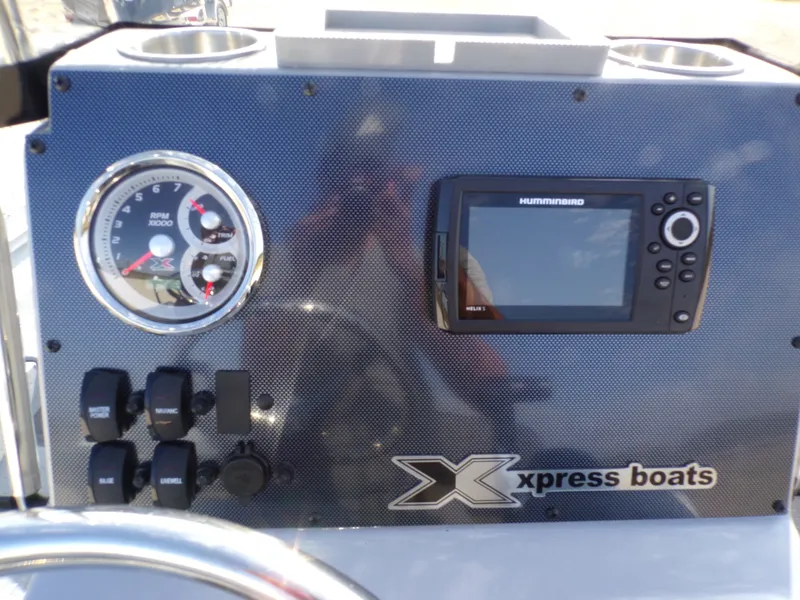 Slide: The Image of Dashboard of 2026 Xpress H20B Bay with tachometer and GPS. - 25