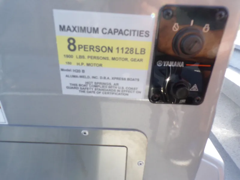 Slide: The Image of Xpress H20B Bay 2026 boat capacity label, Yamaha control. - 26