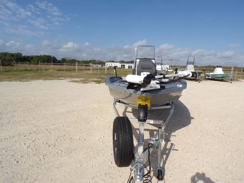 Slide: The Image of 2026 Xpress H20B Bay boat on trailer outdoors. - 5