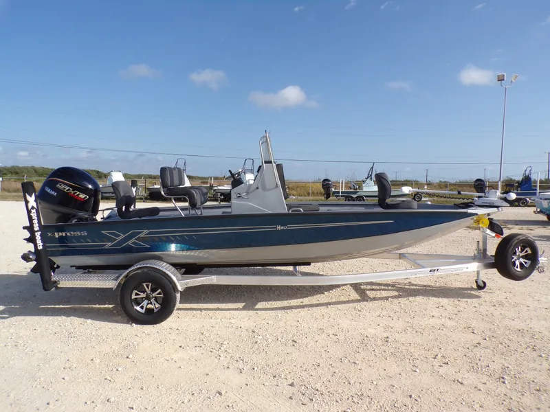 Slide: The Image of 2026 Xpress H20B Bay boat on trailer outdoors. - 7